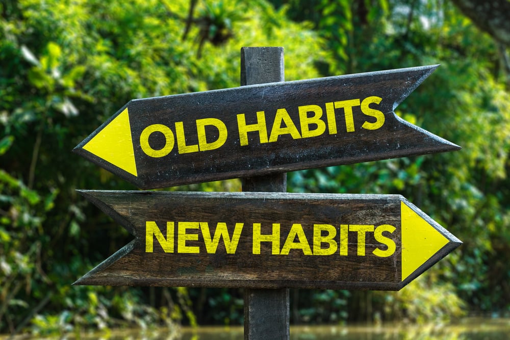 Old Habits - New Habits signpost with forest background-2