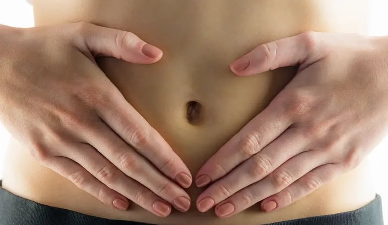 Slim Woman touching her belly